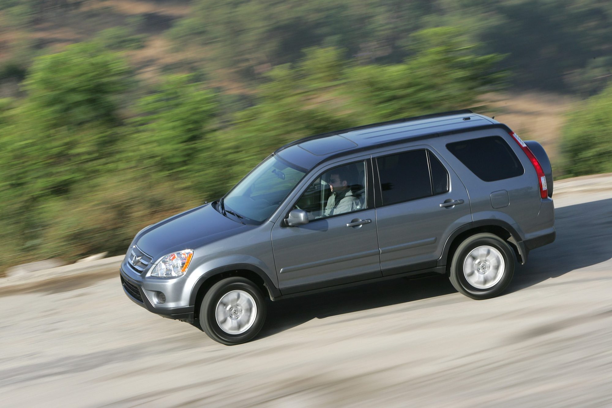 Gray 2006 Honda CR-V SE driving on a hillside road