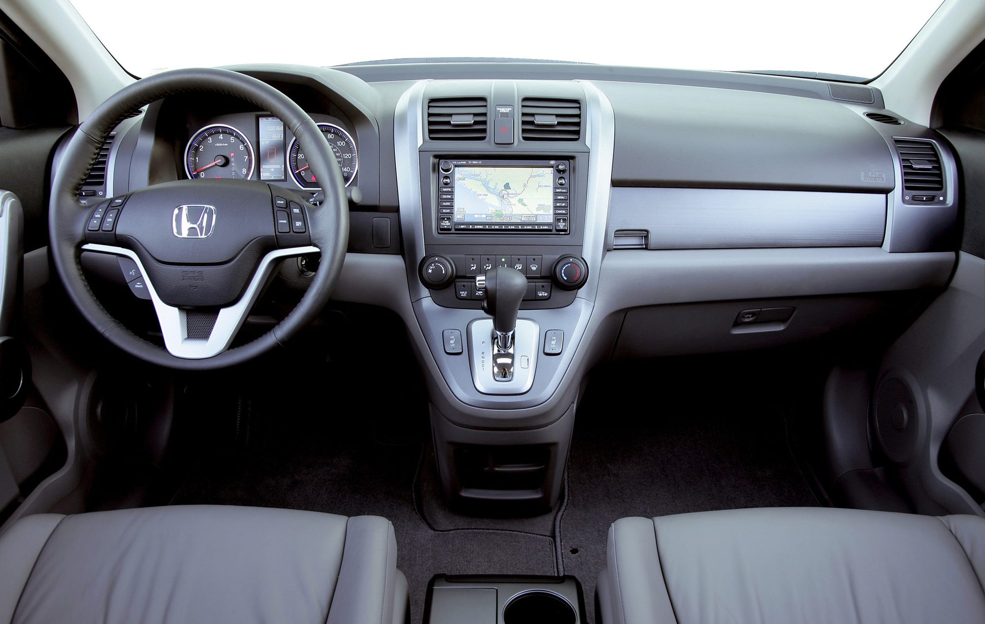 Dashboard of the 2007 Honda CR-V EX-L with the navigation screen and dash-mounted shifter