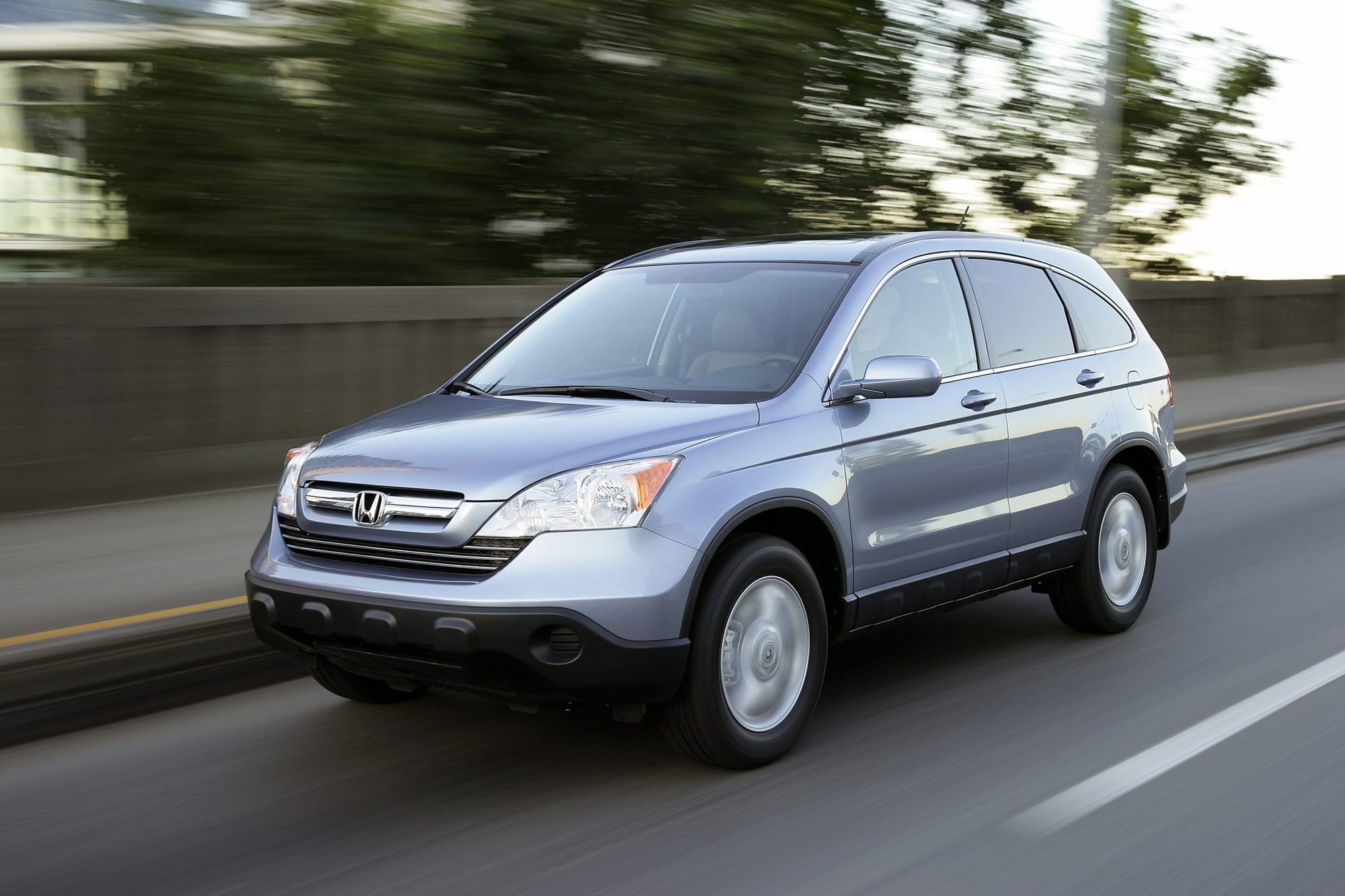Light blue 2007 Honda CR-V EX-L driving on a highway
