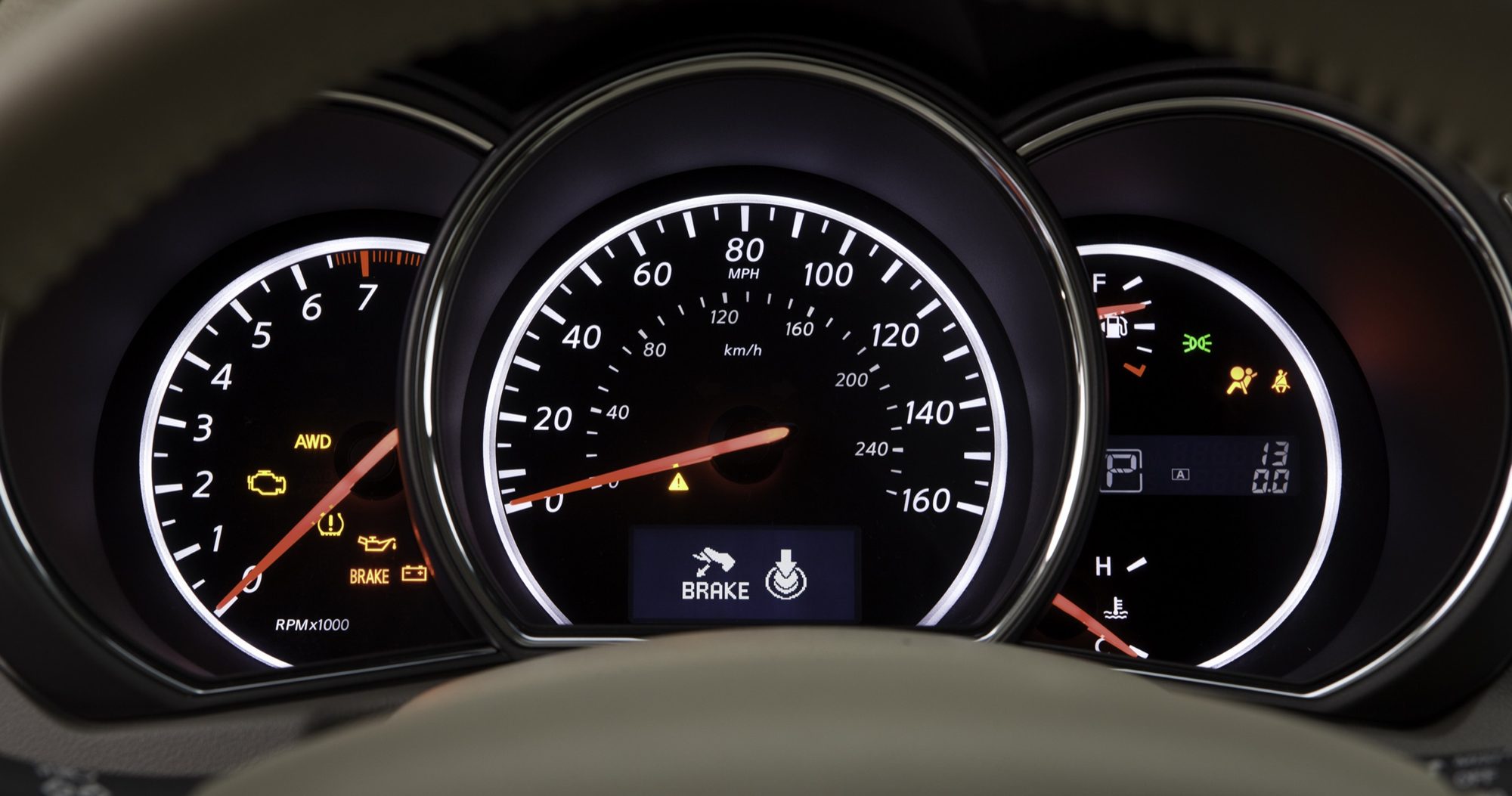 Backlit gauge cluster of the 2011 Nissan Murano with the AWD indicator lit