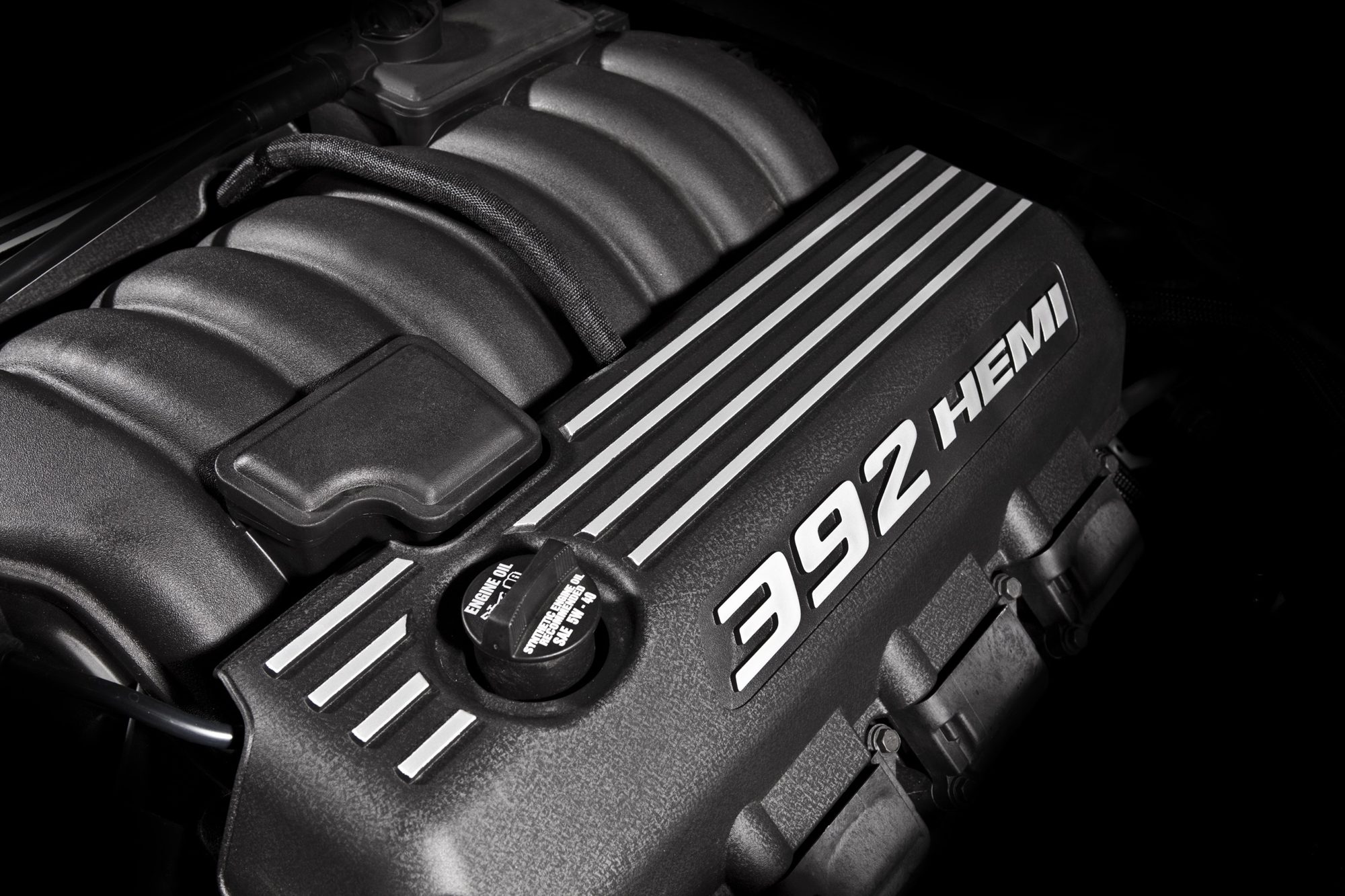 Dodge Challenger SRT8, 2012: Refined, handsome muscle car 2 392 Hemi engine cover under the hood of the 2012 Dodge Challenger SRT8 392