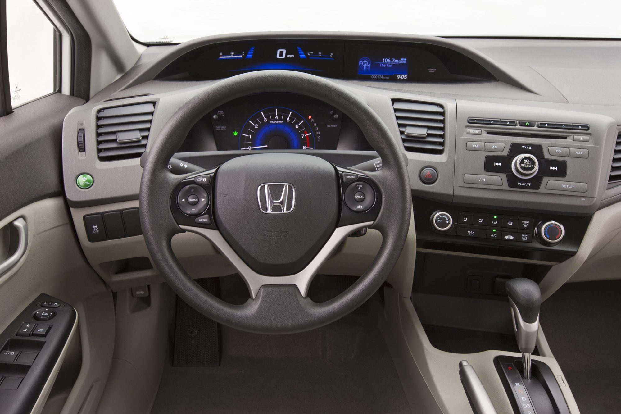 Dashboard of the 2012 Honda Civic HF with the green ECON button at the lower left