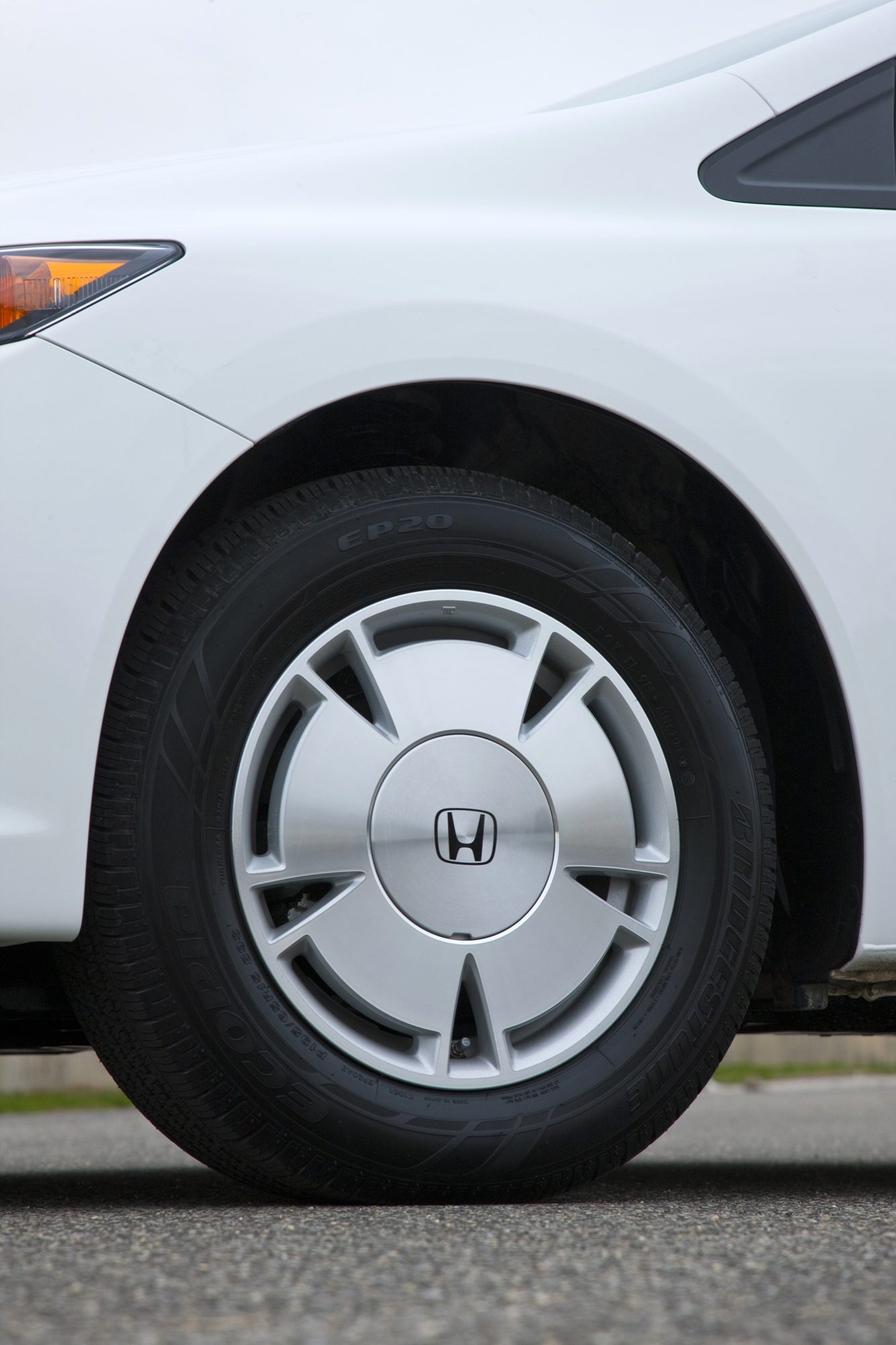 Aerodynamic alloy wheel and low rolling-resistance Bridgestone Ecopia tire on the 2012 Honda Civic HF