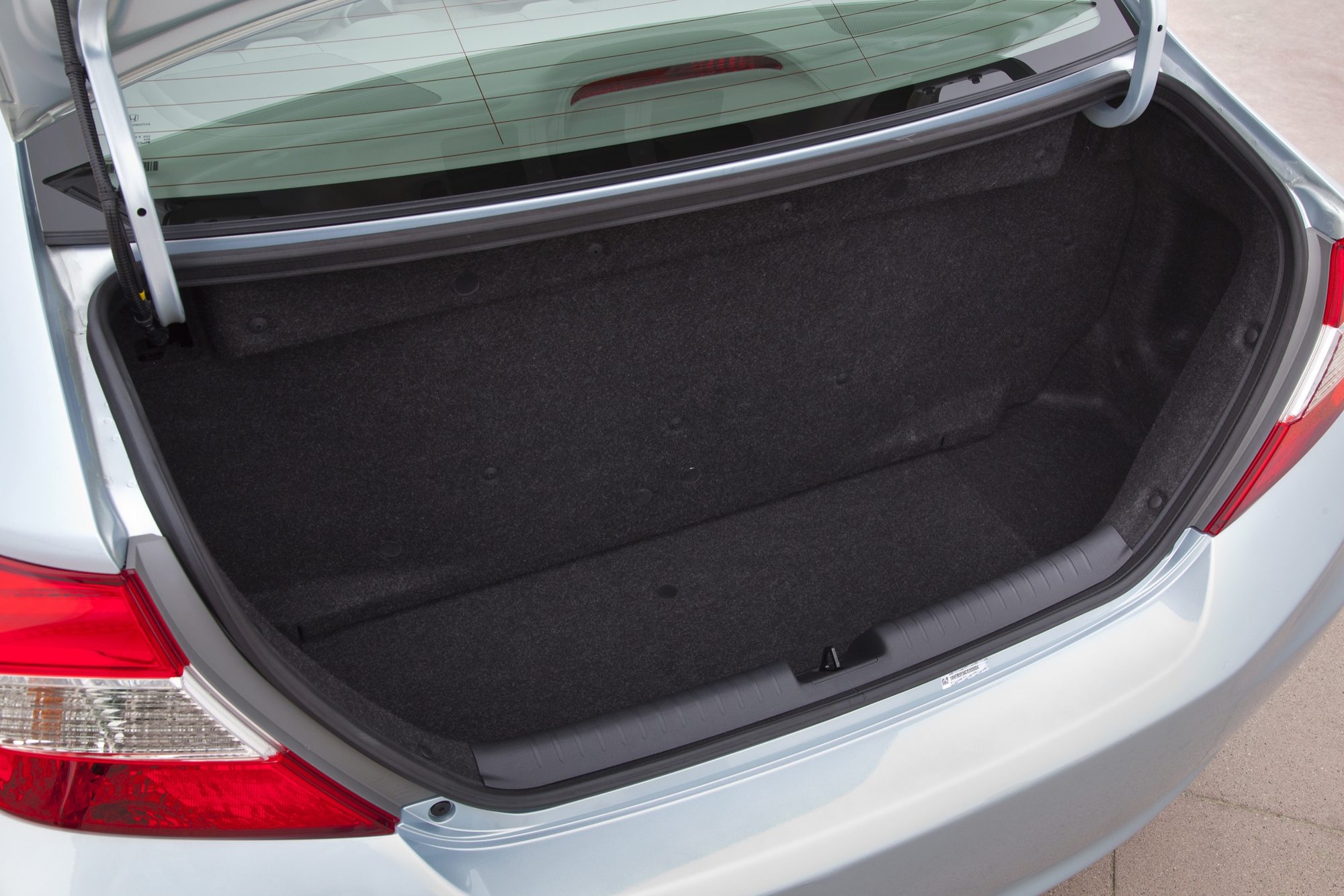 Open trunk of the 2012 Honda Civic Natural Gas, its floor raised over the CNG fuel tank
