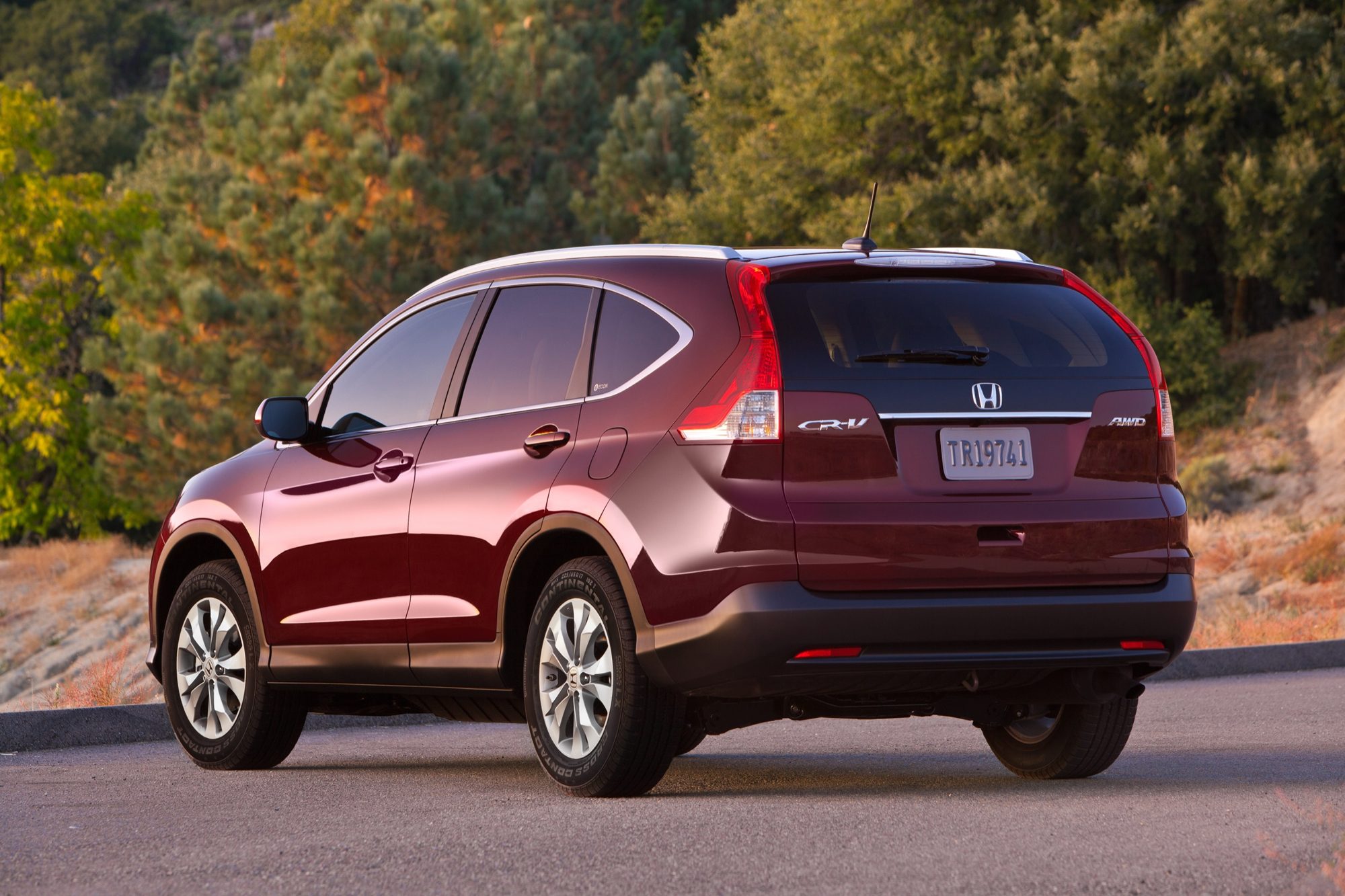 Rear three-quarter view of a dark red 2012 Honda CR-V EX-L AWD