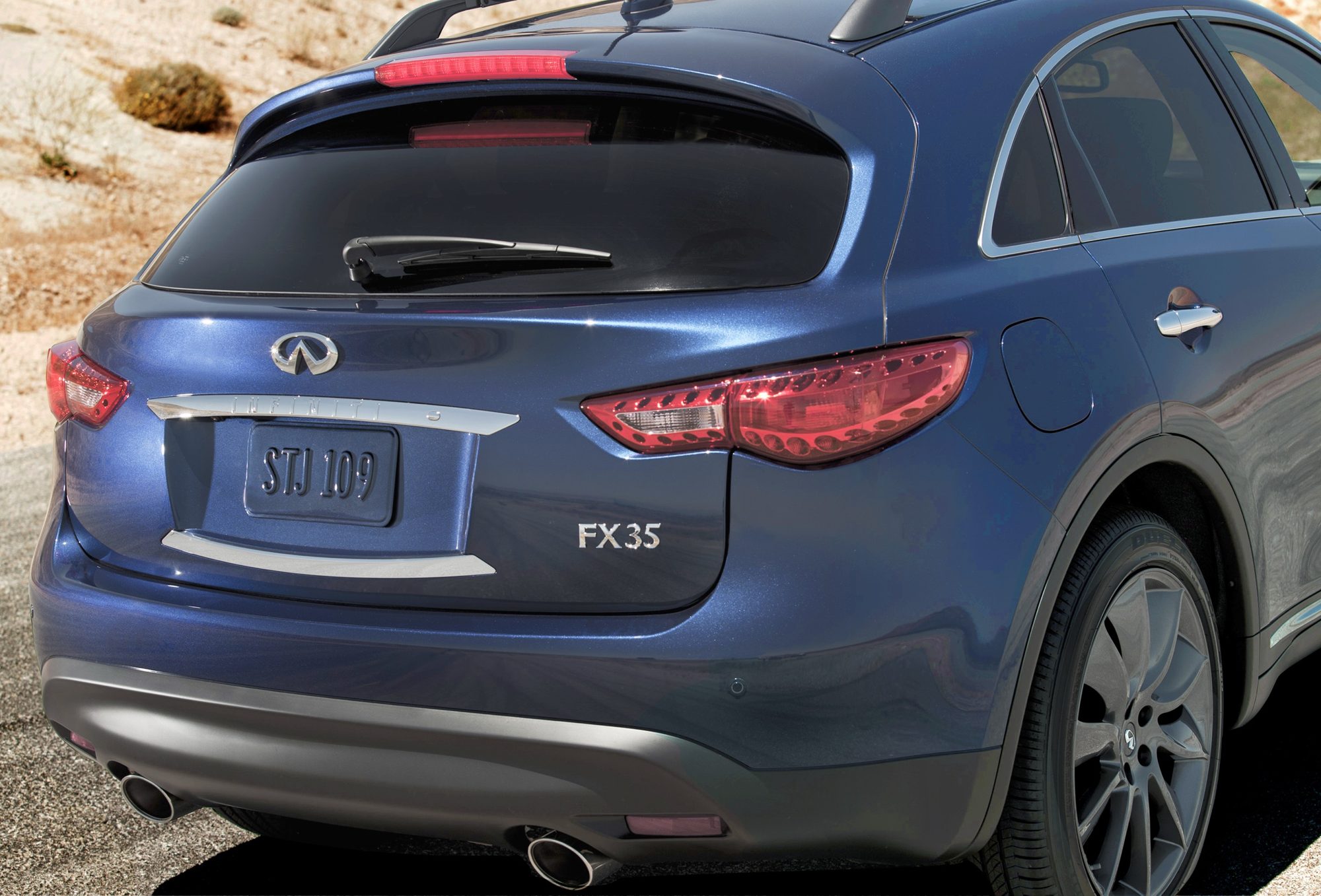 Rear view of an Iridium Blue 2012 Infiniti FX35 Limited Edition showing its FX35 badge