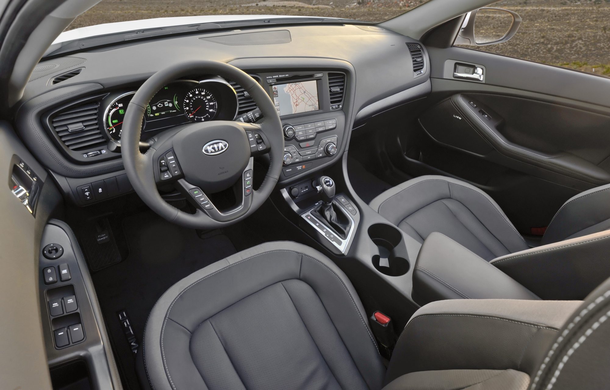 Dashboard and gray front seats of the 2012 Kia Optima Hybrid