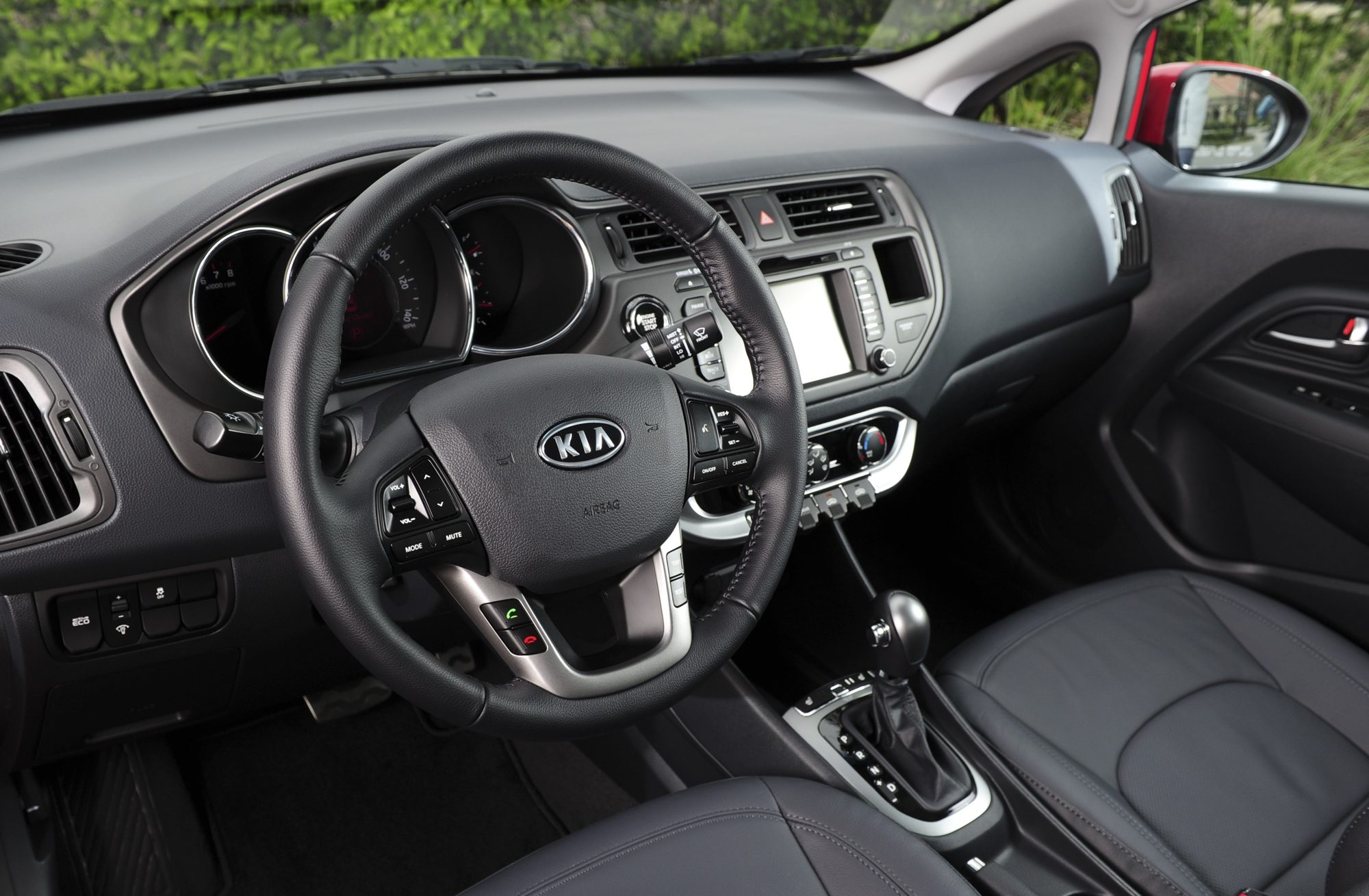 Dashboard and six-speed automatic shifter of the 2012 Kia Rio SX sedan