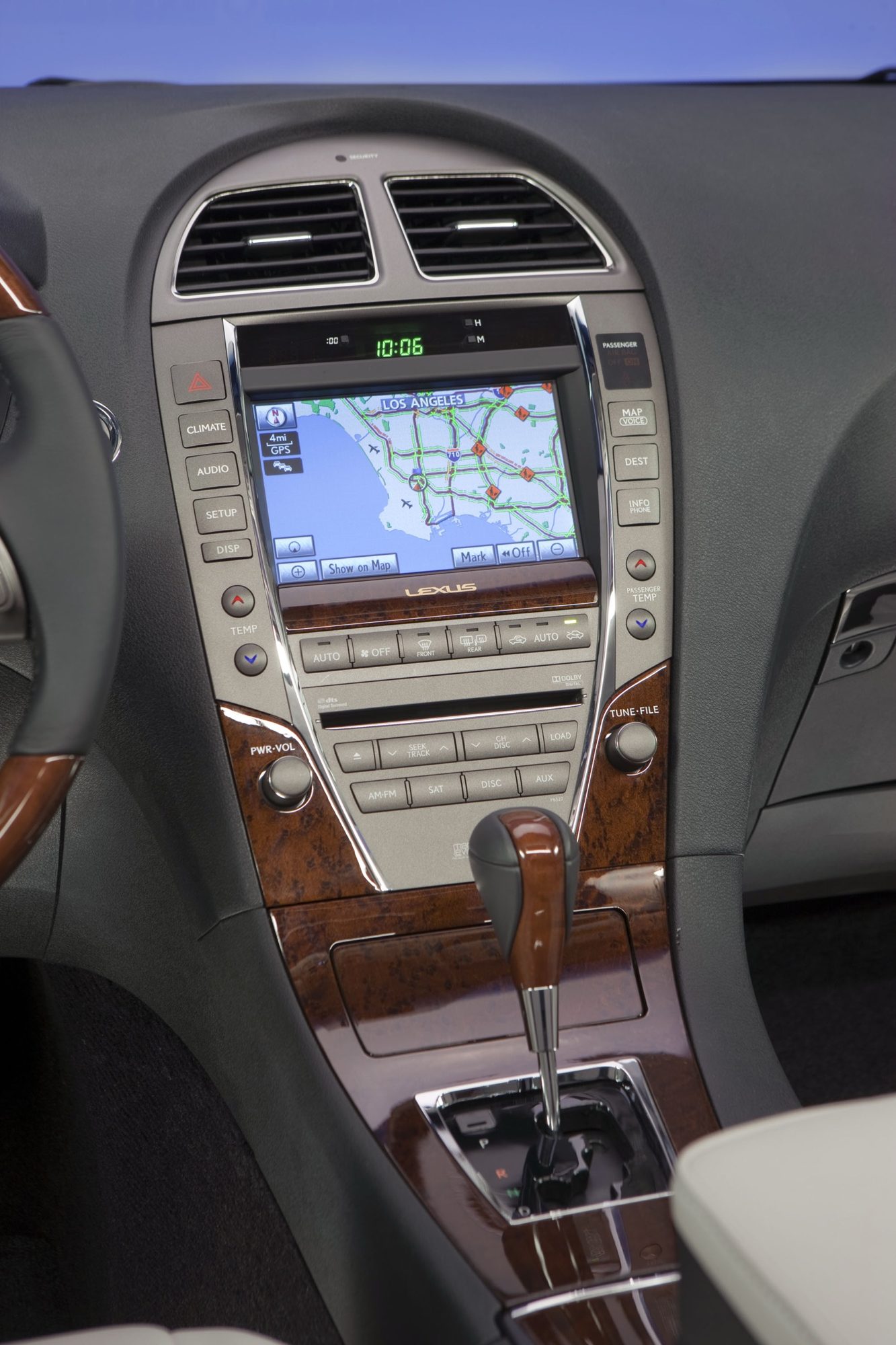 Center stack of the 2012 Lexus ES 350 with the navigation screen, climate controls and wood-trimmed shifter