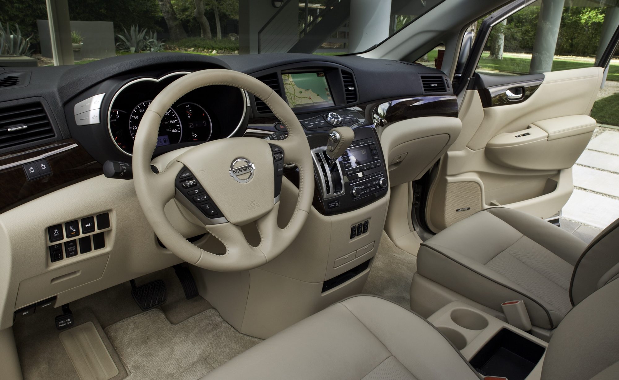 Beige dashboard and front seats of the 2012 Nissan Quest