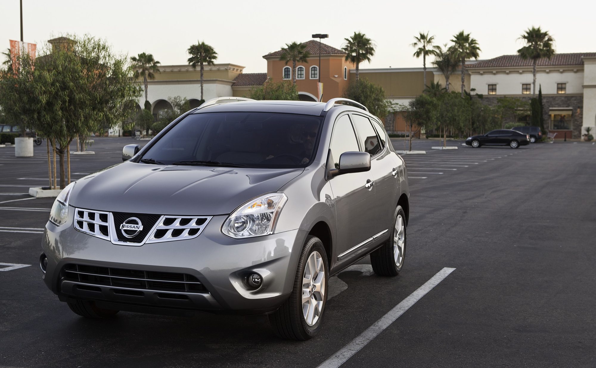Front view of a gray 2012 Nissan Rogue with its chrome grille