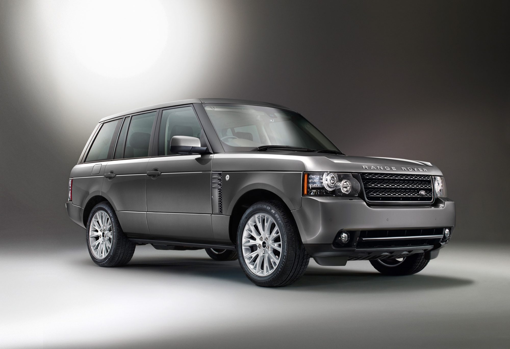 Studio front three-quarter view of a 2012 Range Rover in Stornoway Grey