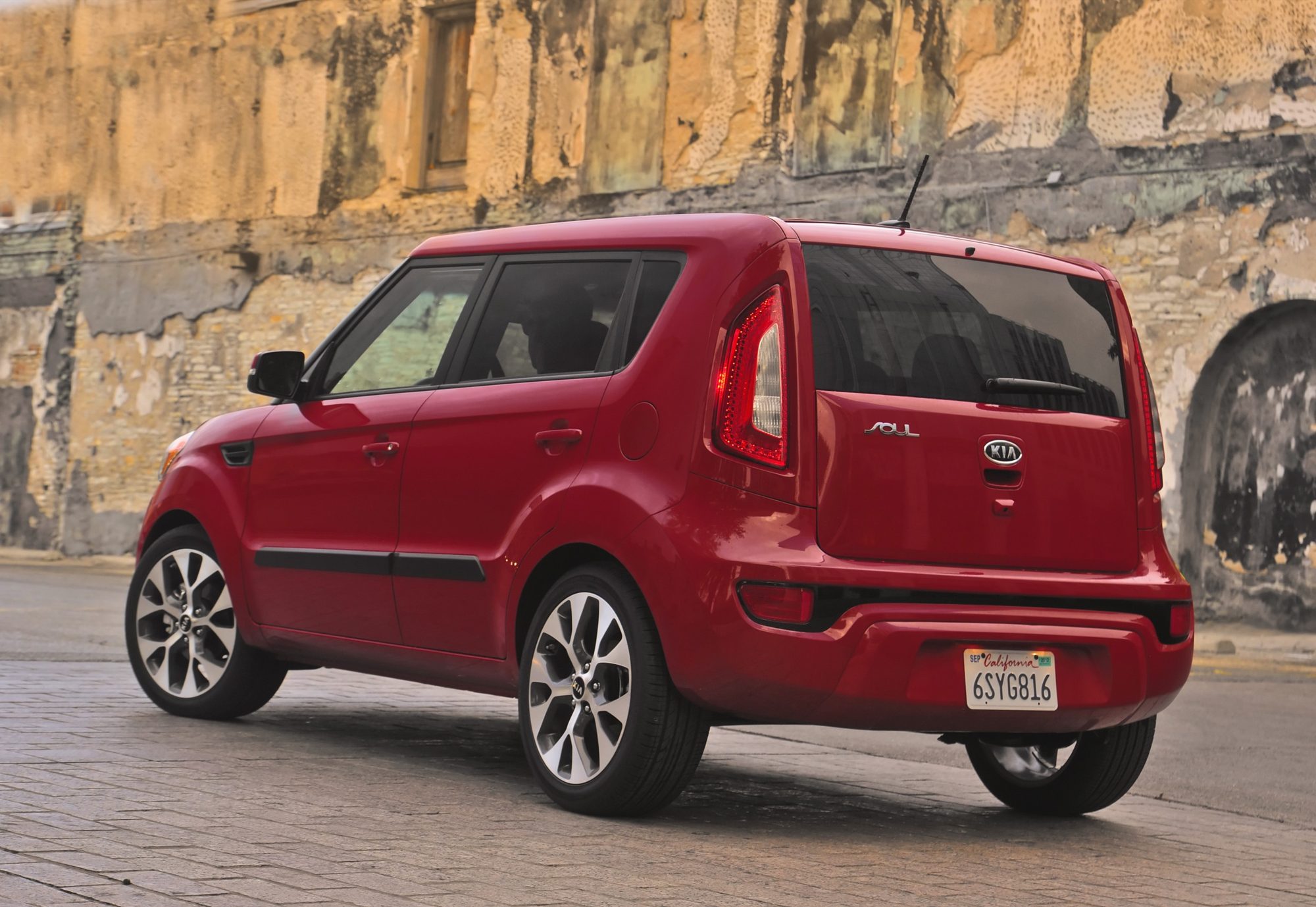 Rear three-quarter view of a red 2013 Kia Soul