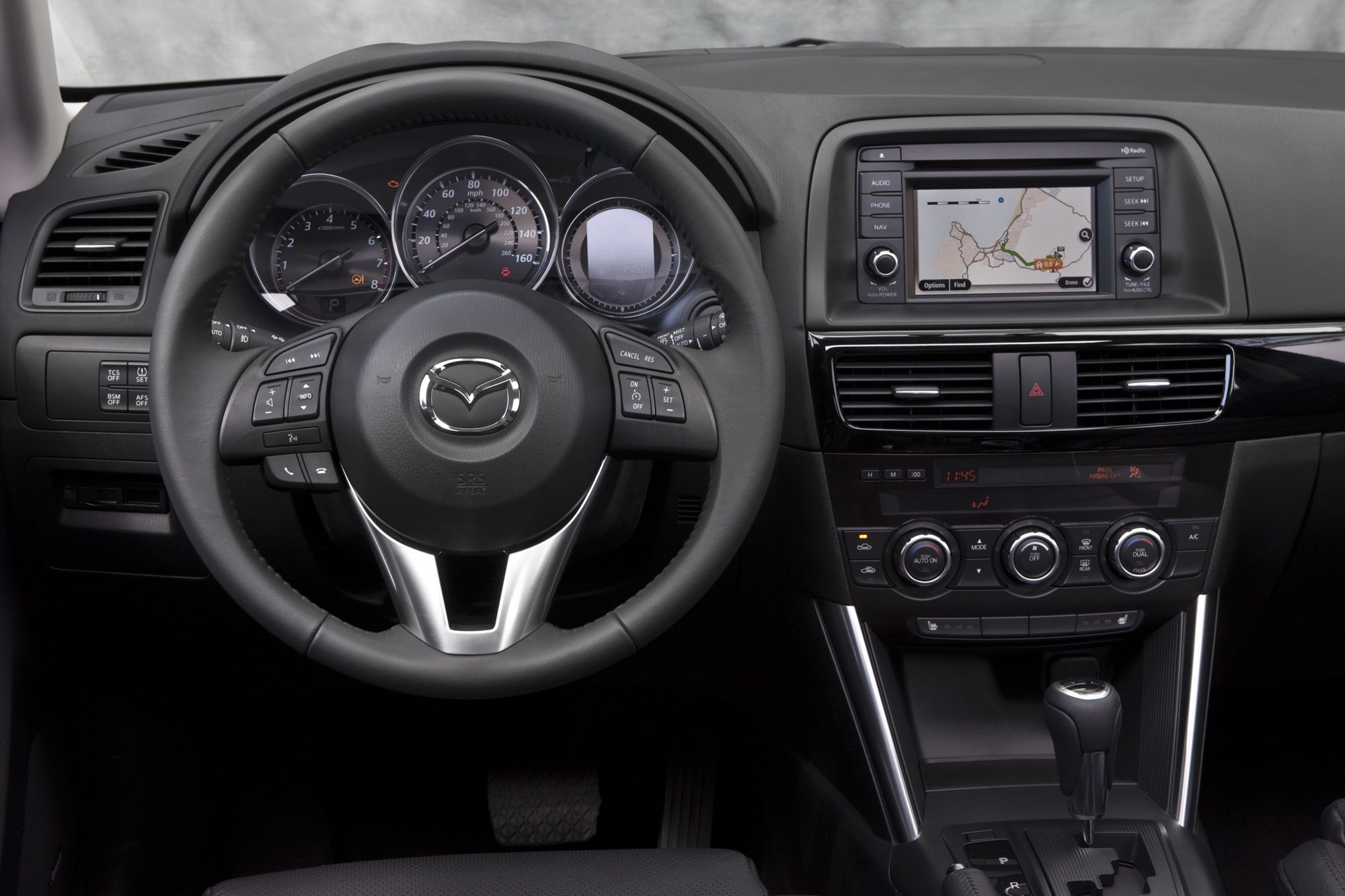 Dashboard of the 2013 Mazda CX-5 with the navigation screen and automatic transmission shifter