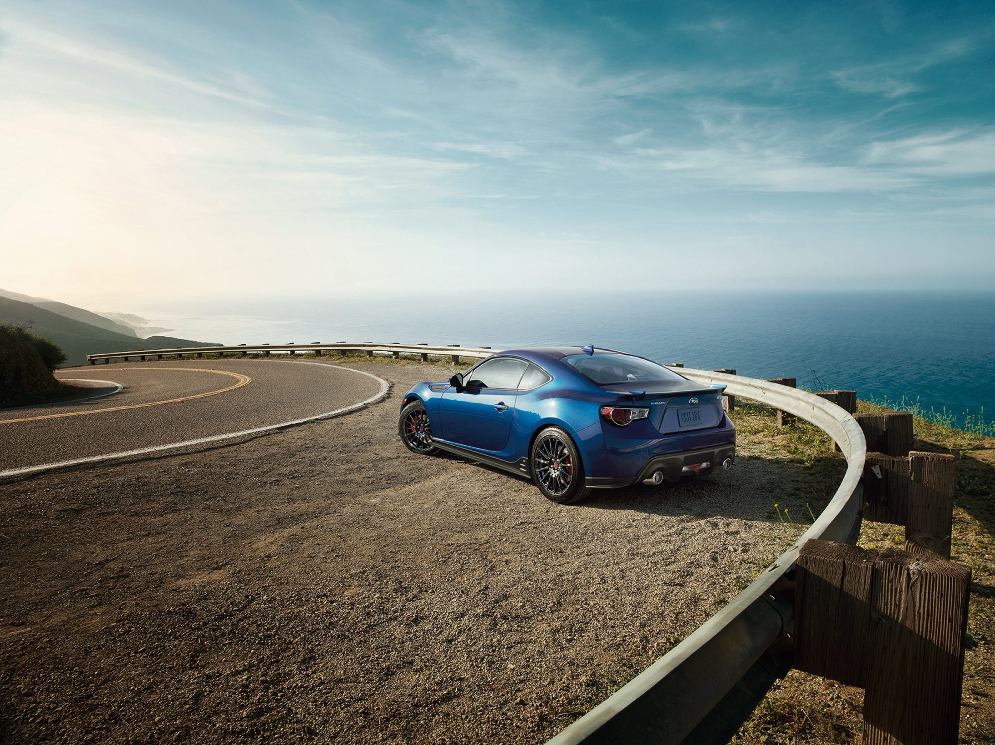 Rear three-quarter view of a blue 2015 Subaru BRZ Series.Blue at a coastal overlook