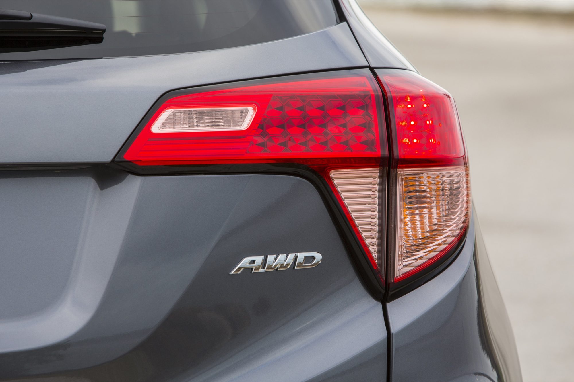 AWD badge and taillight on a gray 2016 Honda HR-V