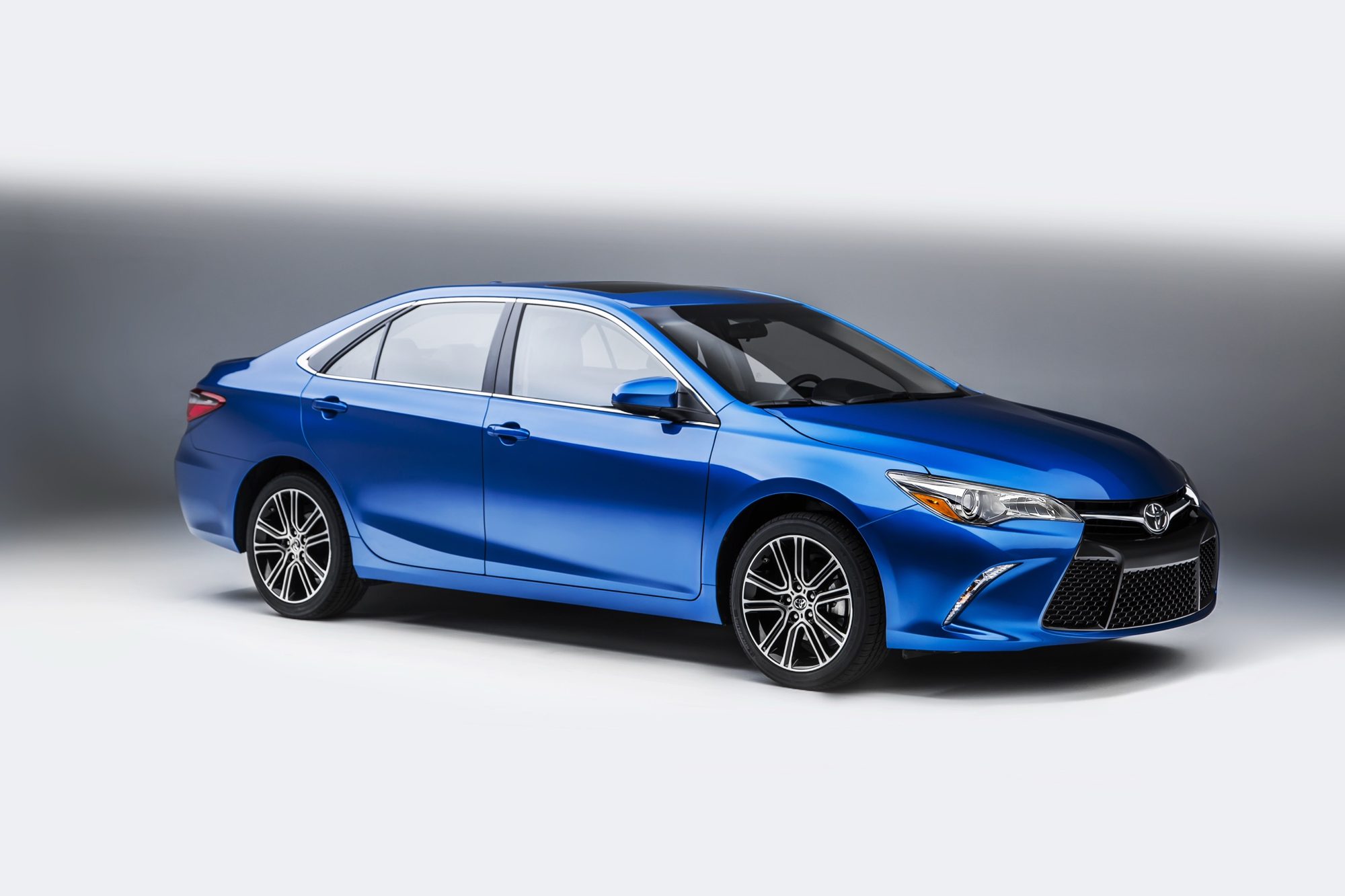2016 Toyota Camry Special Edition in Blue Streak Metallic, front three-quarter studio view