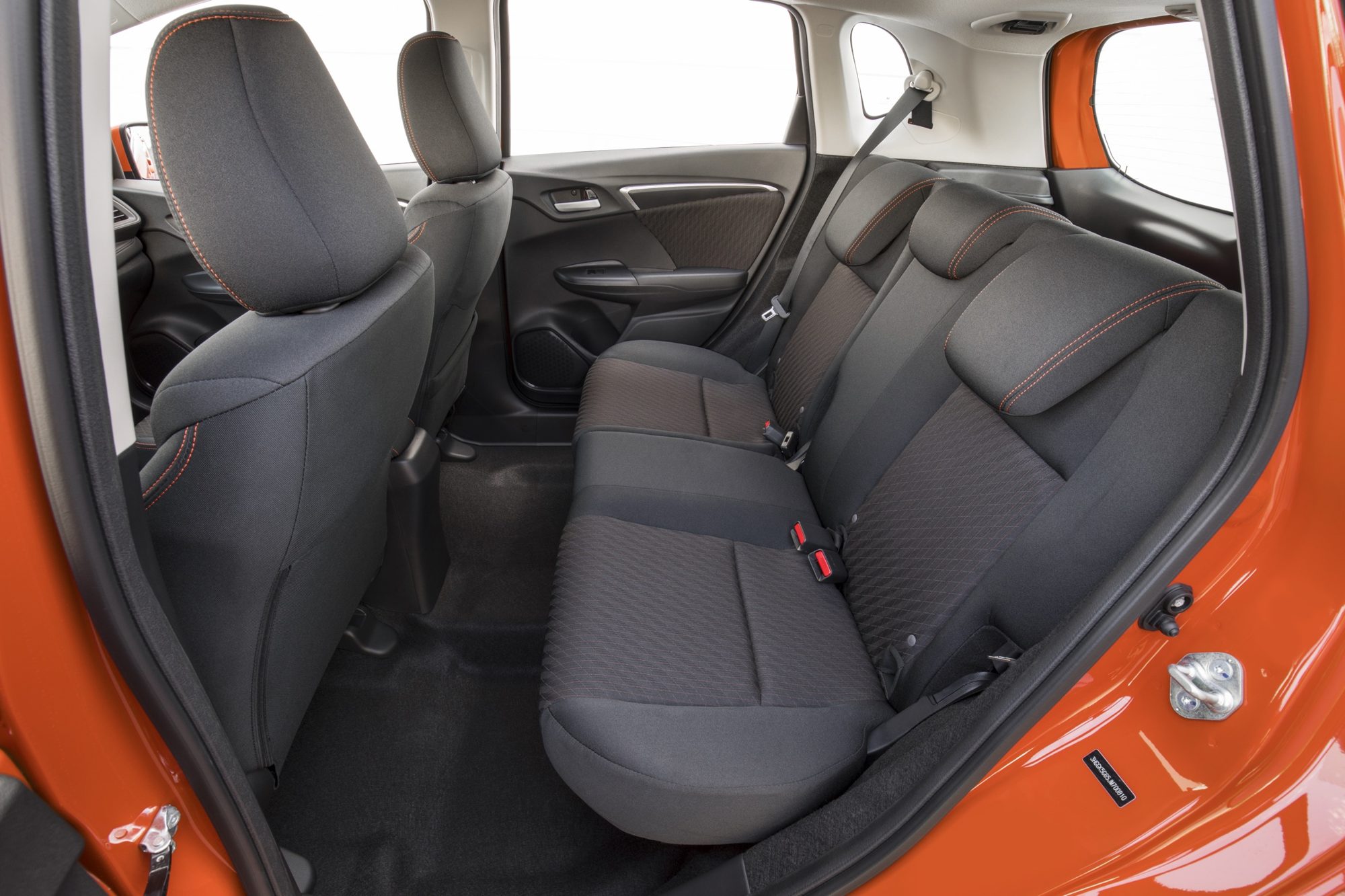 Rear seat of the 2018 Honda Fit Sport with orange contrast stitching