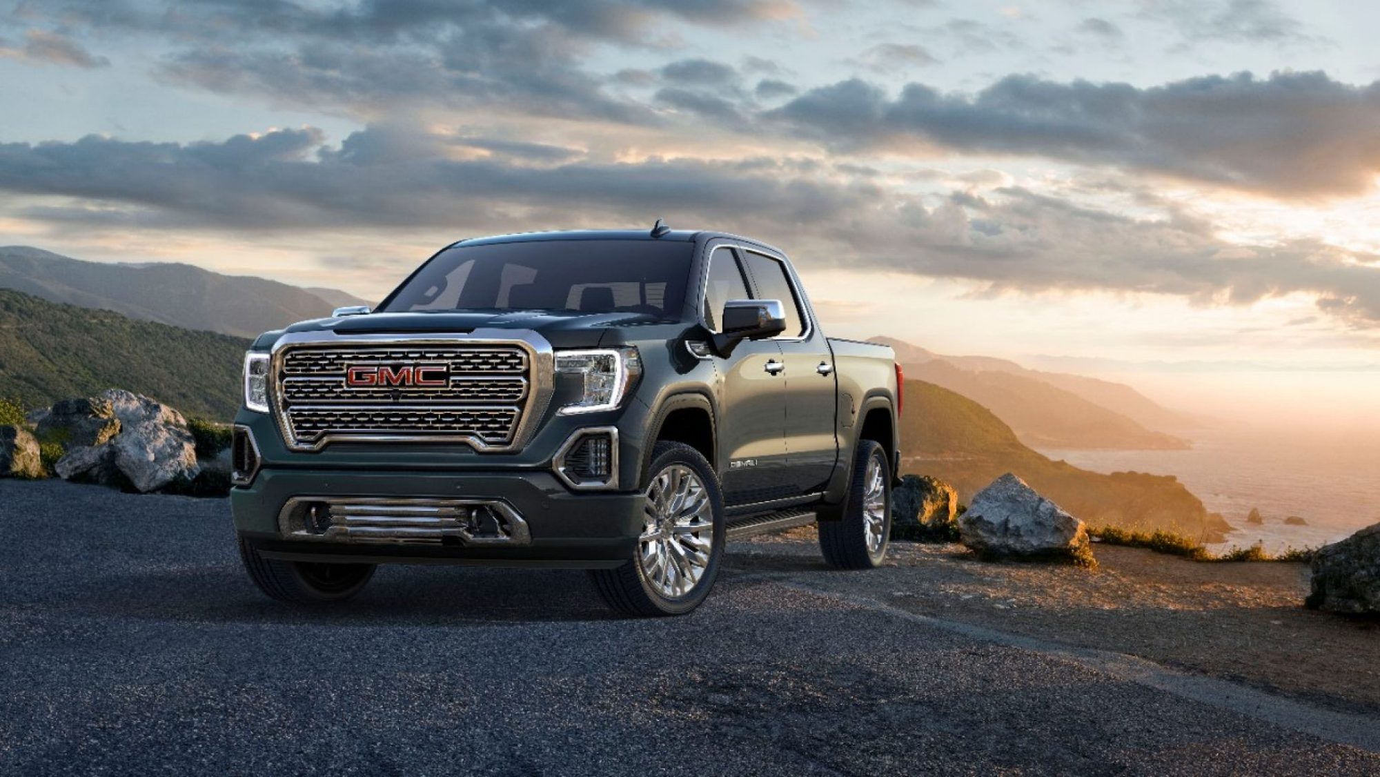 Front three-quarter view of the 2019 GMC Sierra 1500 Denali at sunset