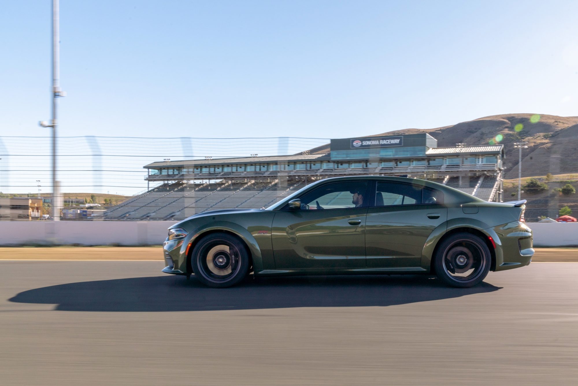 2020 Dodge Charger Scat Pack Widebody in F8 Green on a racetrack