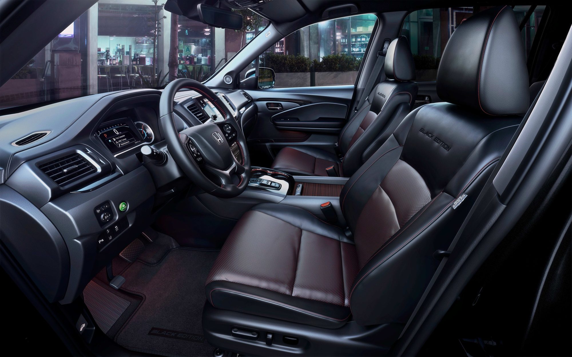 Black leather front seats with red inserts in the 2020 Honda Pilot Black Edition