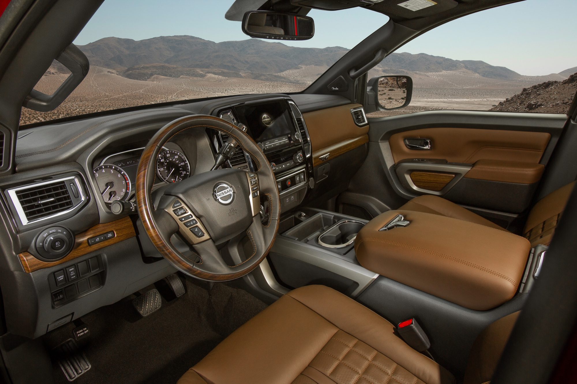Brown quilted leather front seats and wood trim in the 2020 Nissan Titan Platinum Reserve