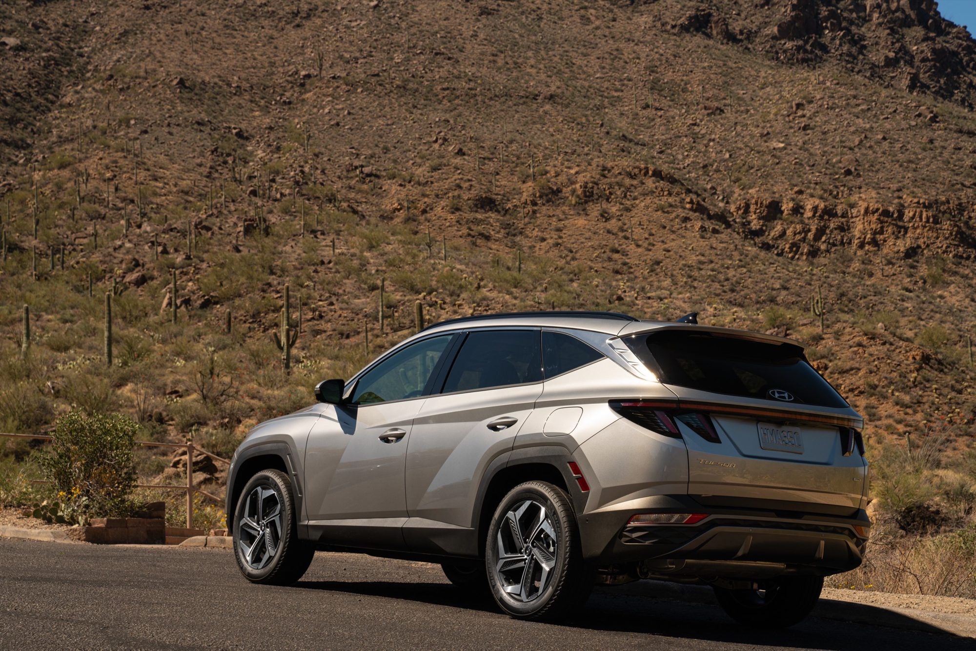Rear three-quarter view of a silver 2022 Hyundai Tucson Hybrid