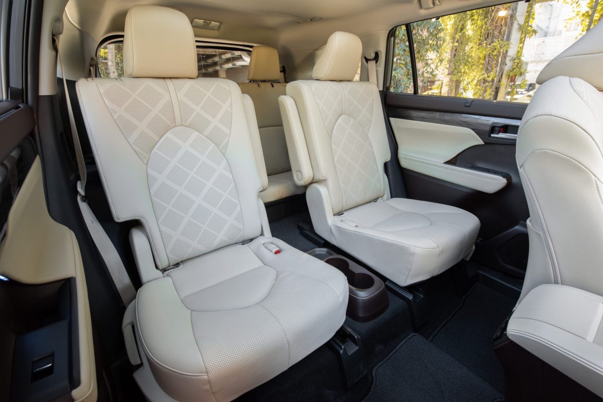 Quilted cream leather second-row captain's chairs in the 2022 Toyota Highlander Platinum