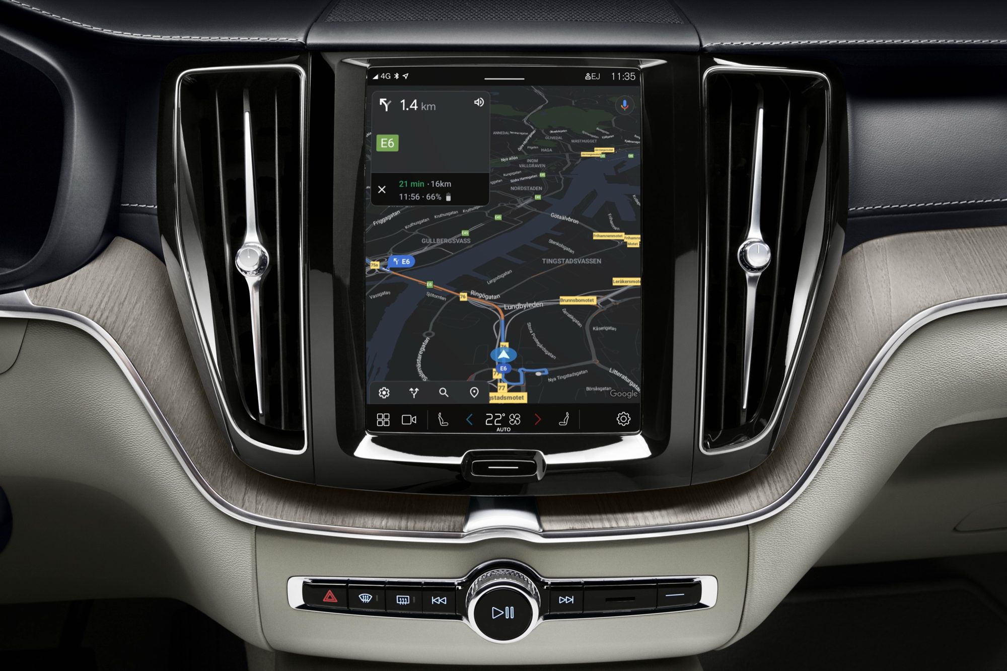 Google Maps on the center touchscreen of the 2022 Volvo XC60, framed by vertical vents and light wood trim