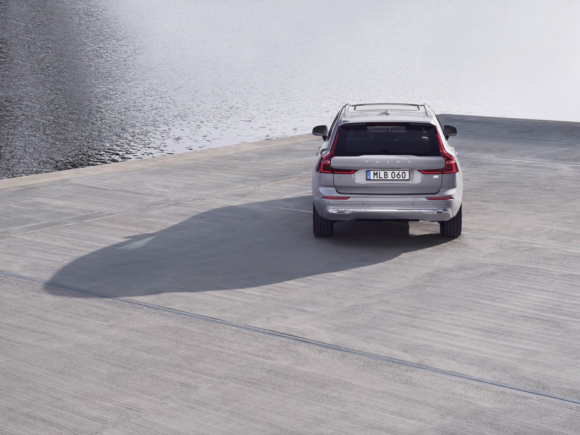 Rear view of a silver 2022 Volvo XC60 on a concrete pier