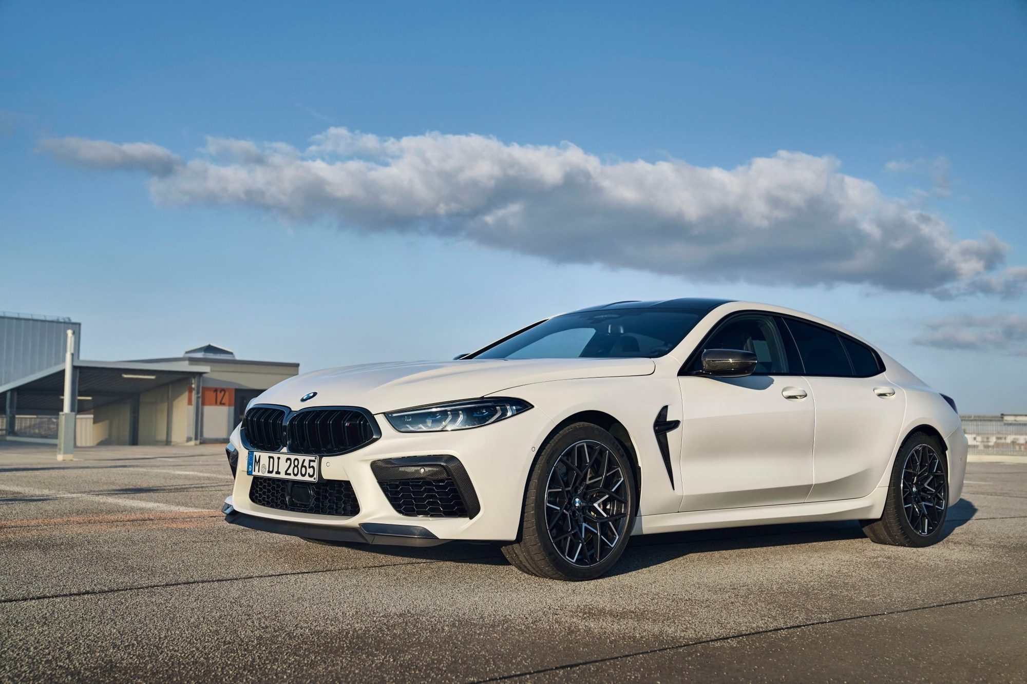 2023 BMW M8 Competition Review: Color Me Green Like Money 5 Front three-quarter view of a white 2023 BMW M8 Competition Gran Coupe