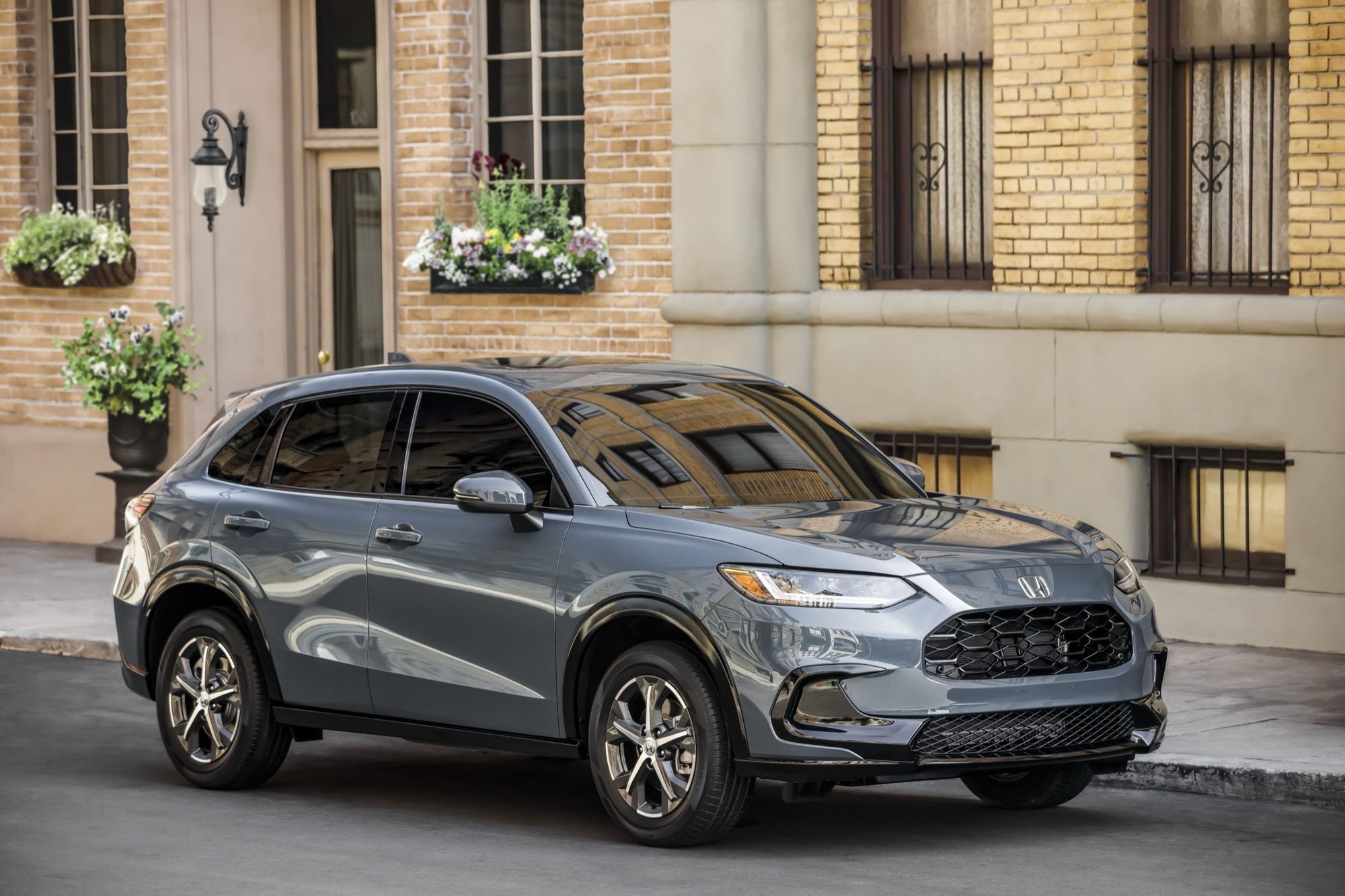 Front three-quarter view of a gray 2023 Honda HR-V EX-L parked on a city street