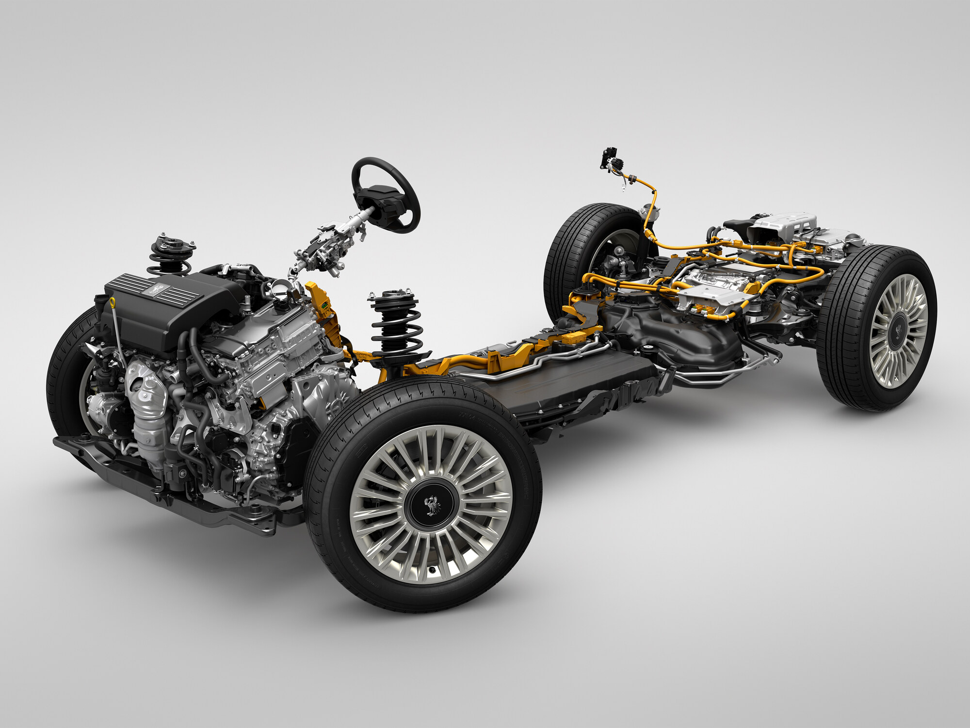 Toyota Brought the Century to Detroit and Called It a Global Model 5 Cutaway of the Toyota Century plug-in hybrid powertrain showing the V6 engine, battery pack and rear electric axle