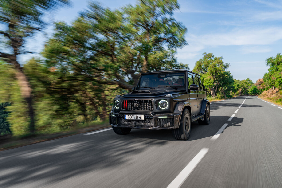Brabus Is Building 10 Open-Top 900 Rocket Edition G 63s and Lists One at €1,020,275 1 Black Brabus 900 Rocket Edition Cabrio driving on a tree-lined road, front three-quarter view with the soft top closed