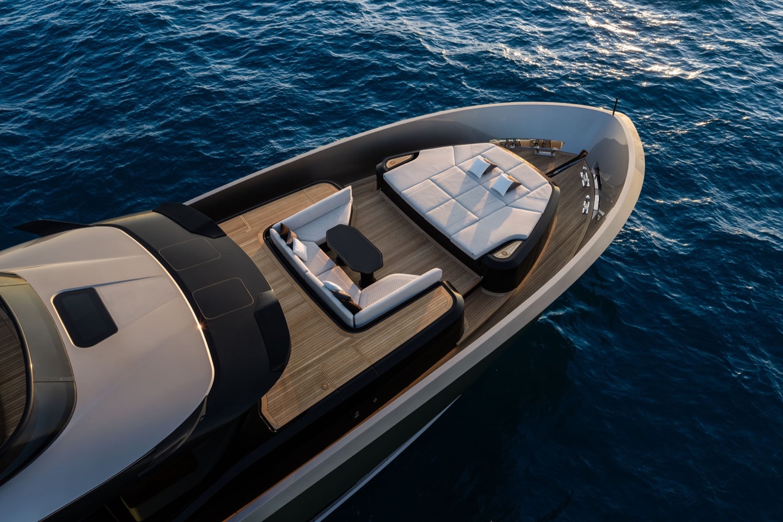 Brabus Now Sells a 110-Foot Yacht With Up to 7,800 HP and a 48-Knot Top Speed 3 Bow of the Brabus AB110 yacht seen from above, with a large sunpad and a seating area around a table