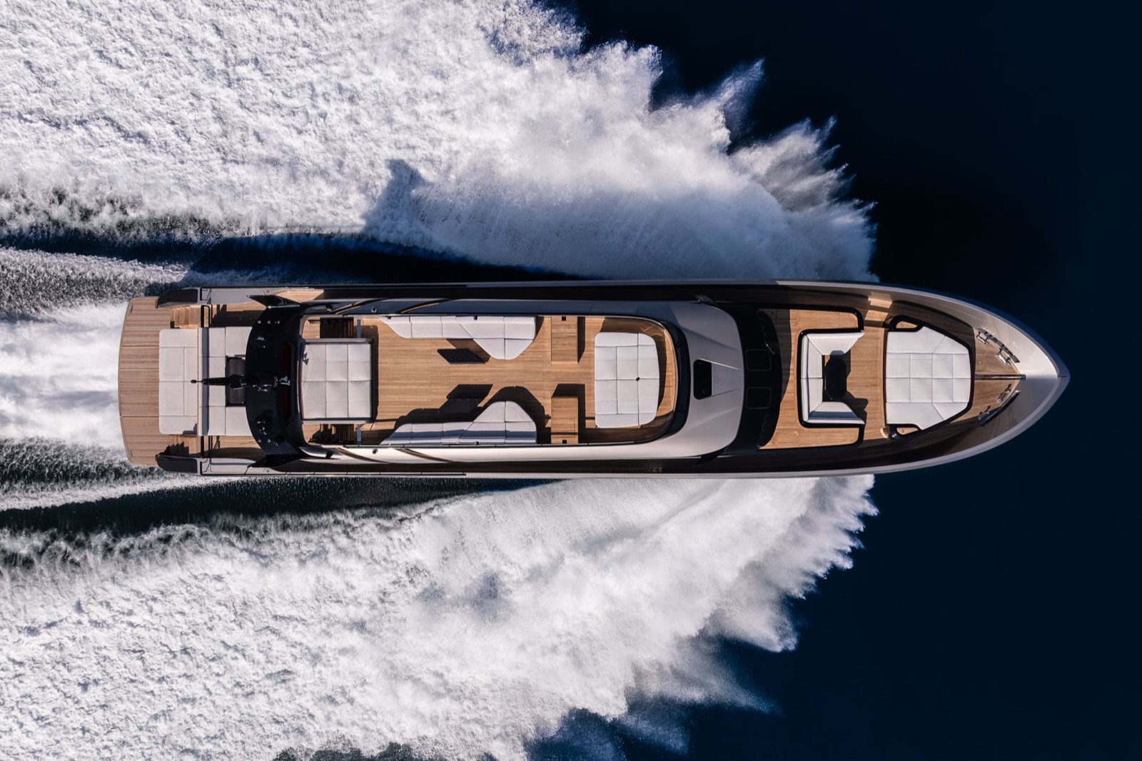 Brabus Now Sells a 110-Foot Yacht With Up to 7,800 HP and a 48-Knot Top Speed 2 Overhead view of the Brabus AB110 yacht at speed, showing the sun deck, sunpads and teak decking