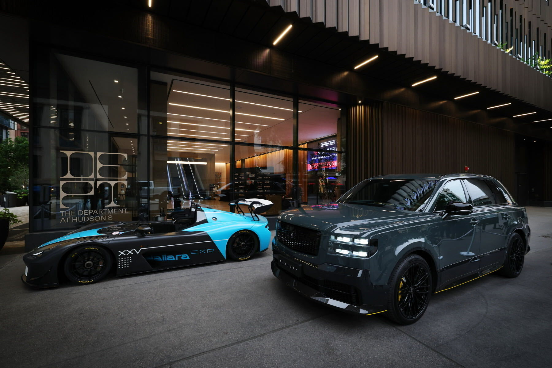 Toyota Brought the Century to Detroit and Called It a Global Model 1 Dark gray Toyota Century on black wheels parked beside a Dallara race car outside The Department at Hudson's in Detroit