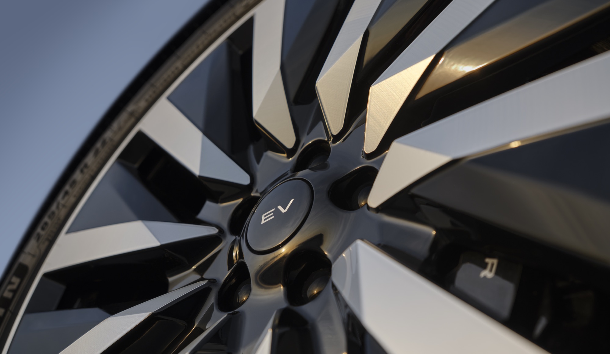 Range Rover Electric Starts at $138,000, the Same Price as the V8 SE 8 Close-up of a Range Rover Electric alloy wheel with an EV badge on the center cap