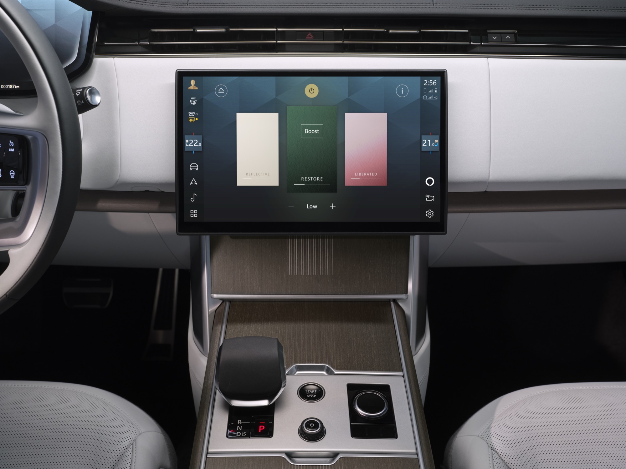 Center touchscreen and console of the 2027 Range Rover Electric with light upholstery and wood trim