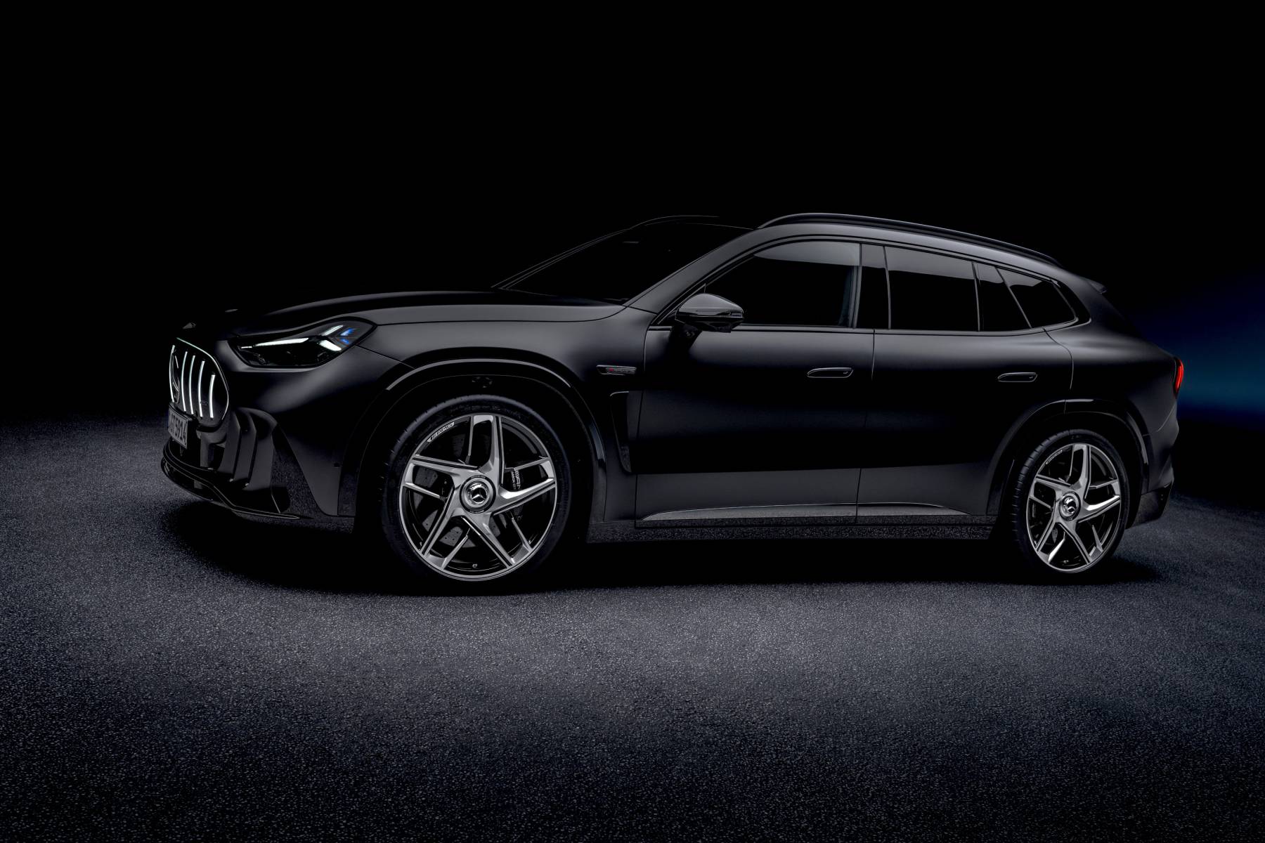 The 1,153-HP Mercedes-AMG GT SUV Plays Back a Recorded AMG V8 3 Black 2028 Mercedes-AMG GT SUV in side profile in a dark studio showing its sloping roofline and five-spoke wheels