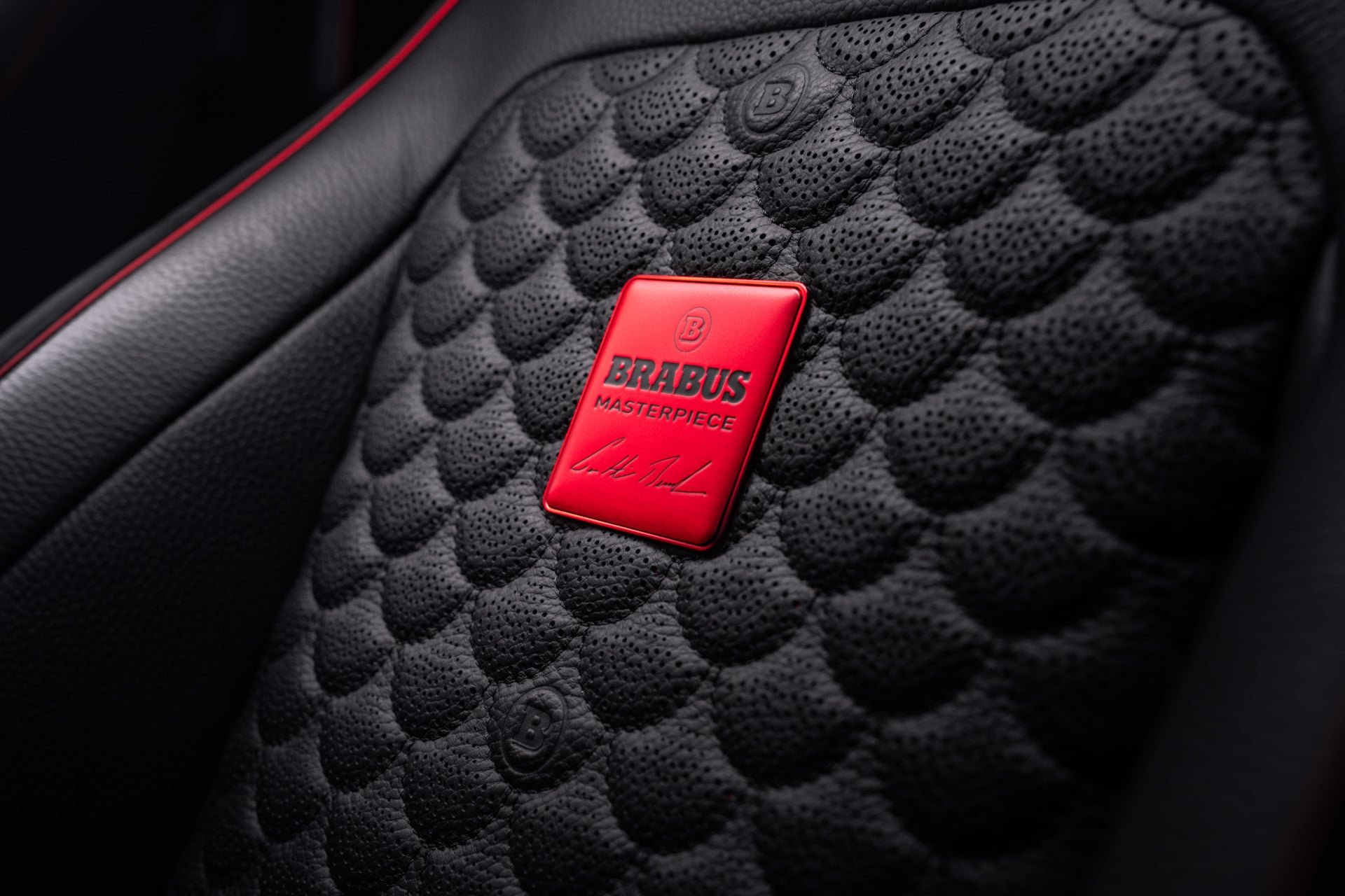 Quilted black leather seat in the Brabus P 900 Rocket Edition with a red Brabus Masterpiece badge