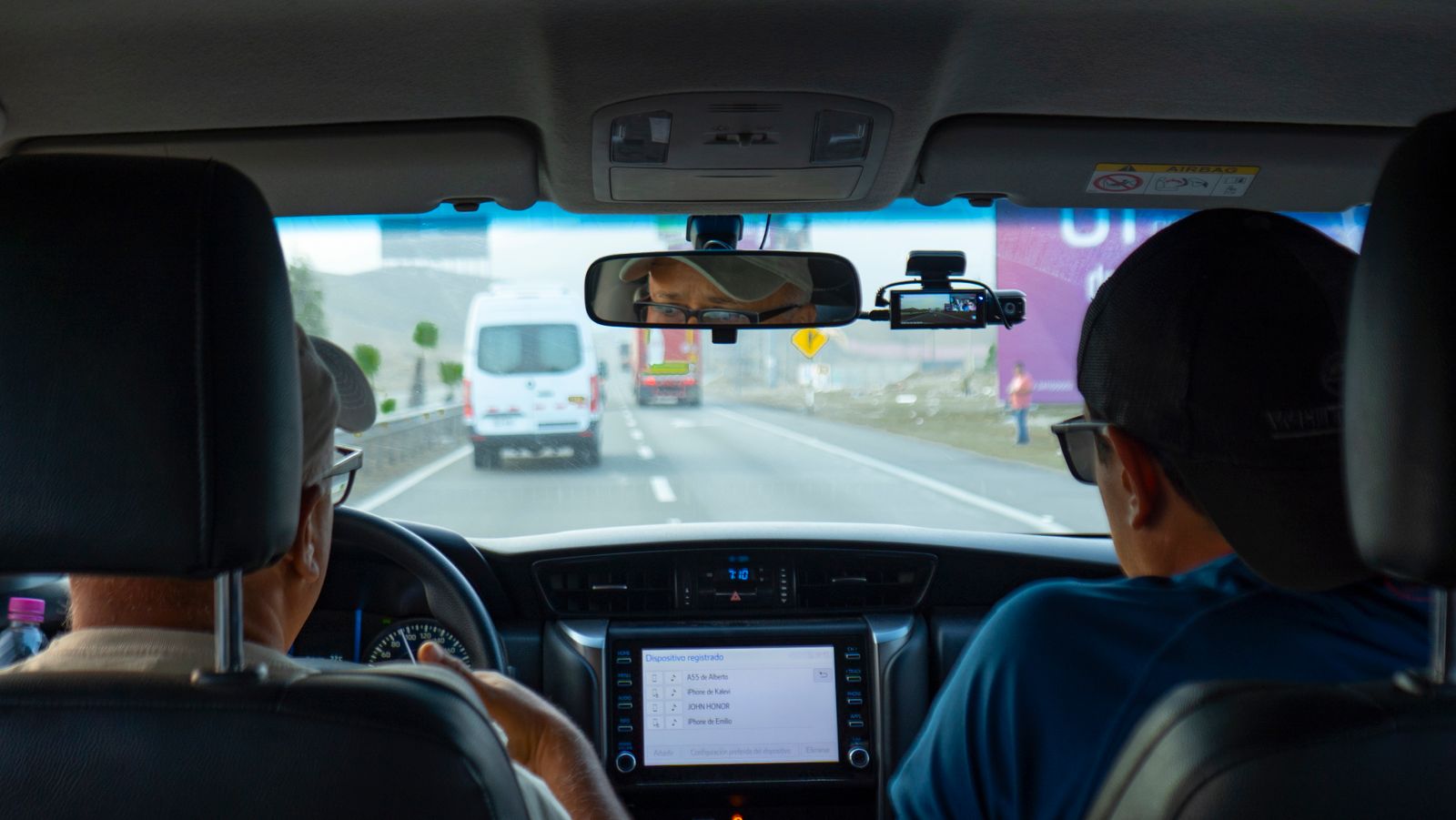 Injury Compensation After a Collision Calls for Detailed Proof 2 View from the back seat of a car on a highway with a dash camera on the windshield