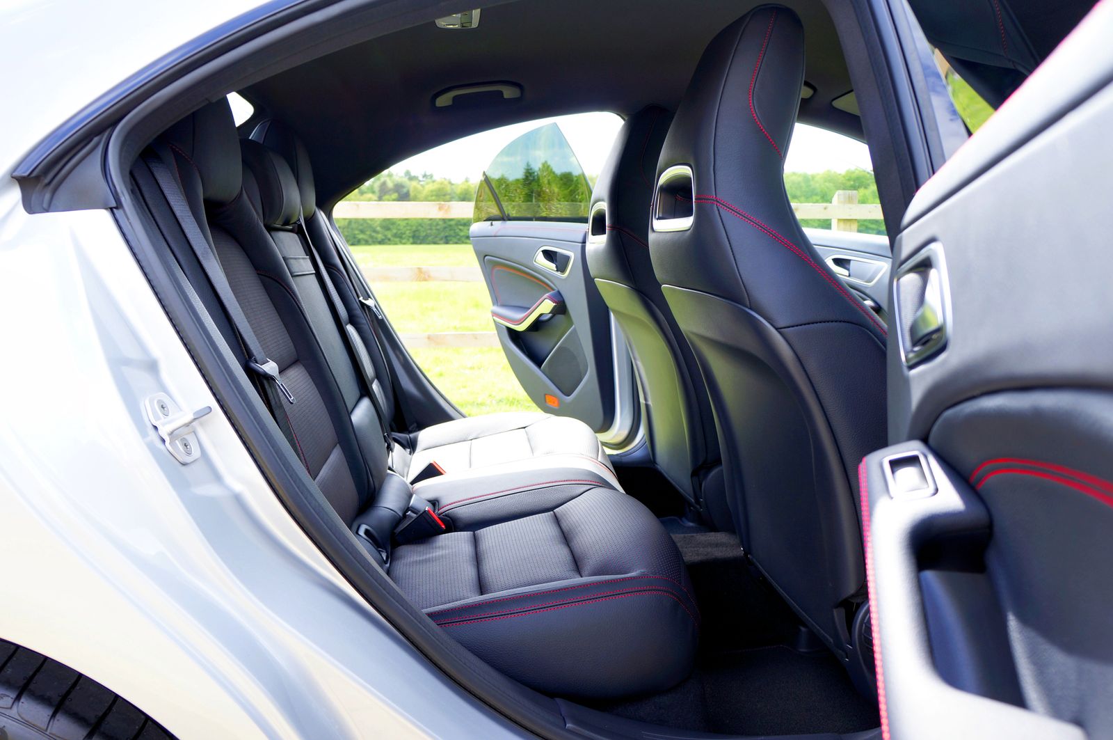 Rear passenger seats of a car with the doors open
