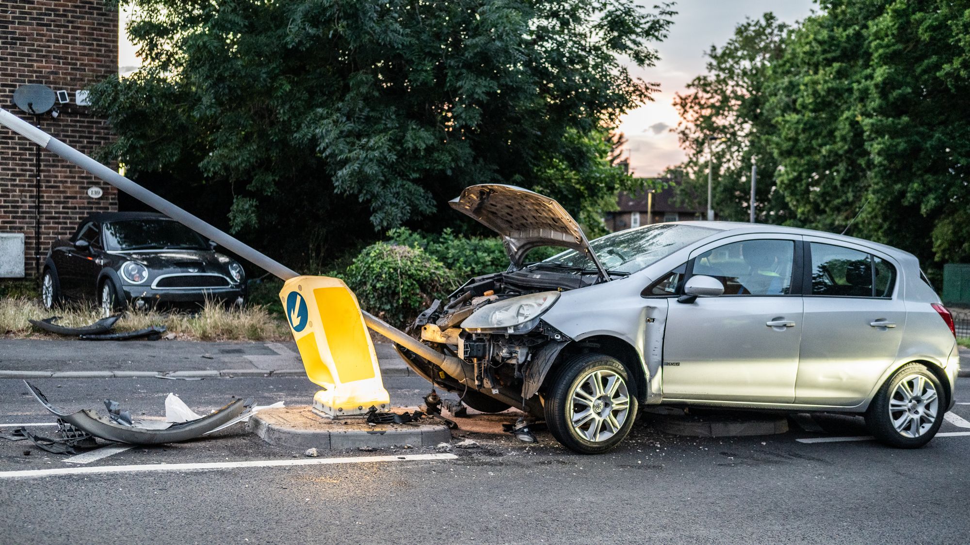 Aventura Car Accident Injuries That Show Up Days Later and Still Count 2 Silver hatchback with a crushed front end after hitting a lamp post