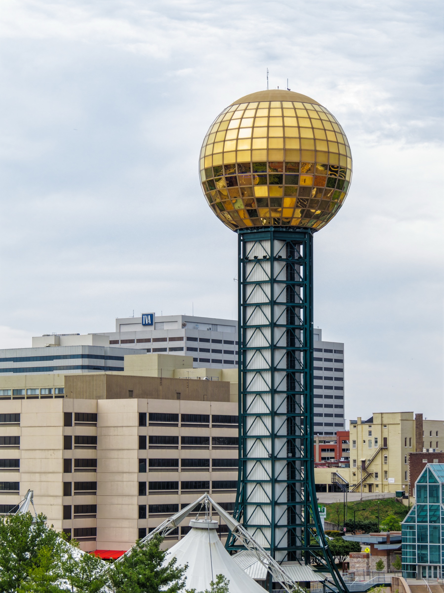 Gold glass Sunsphere tower at World's Fair Park in Knoxville, Tennessee, with downtown office buildings behind it