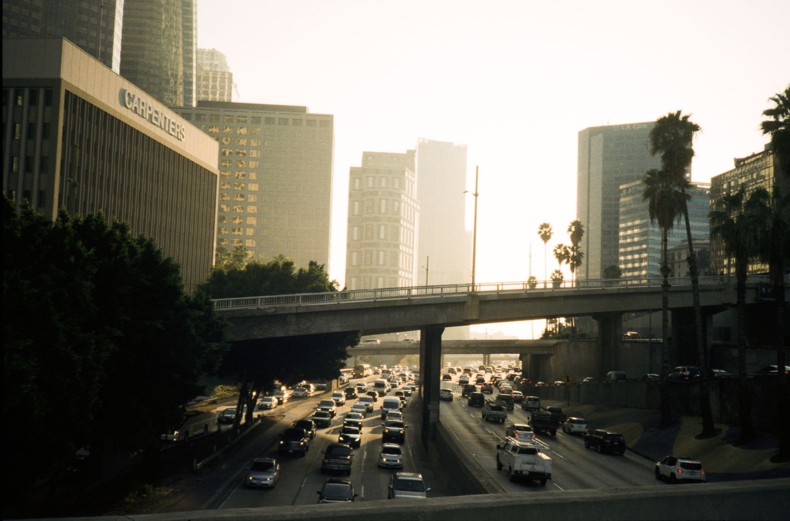 Downtown Los Angeles freeway traffic at sunset