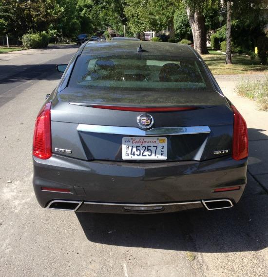 The rear end of the 2014 Cadillac CTS has sharp, pointed lines.