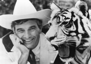 Car dealer Cal Worthington and one of his many animals named "Spot."