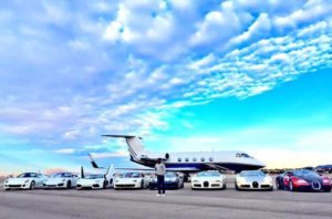 Floyd Mayweather with his jet and car collection.